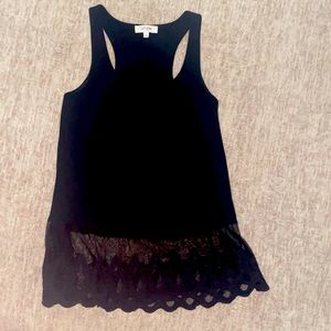 Black racerback tank with lace trim around bottom.